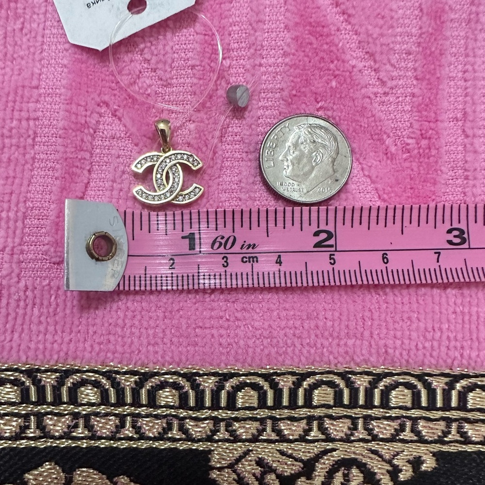 14k gold yellow gold Chanel symbol Pendant